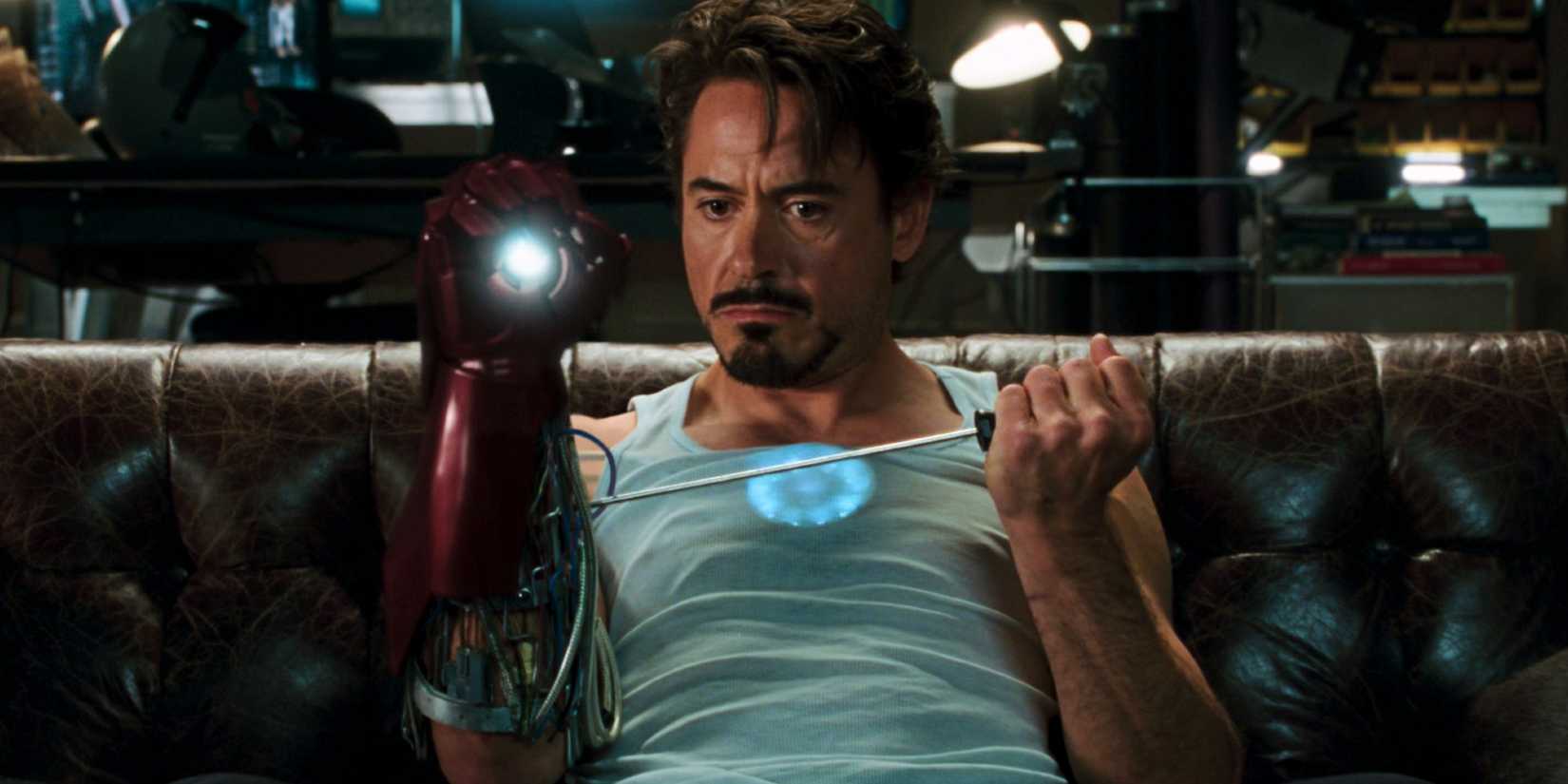 Robert Downey Jr.'s Tony Stark tinkering with his Iron Man gauntlet