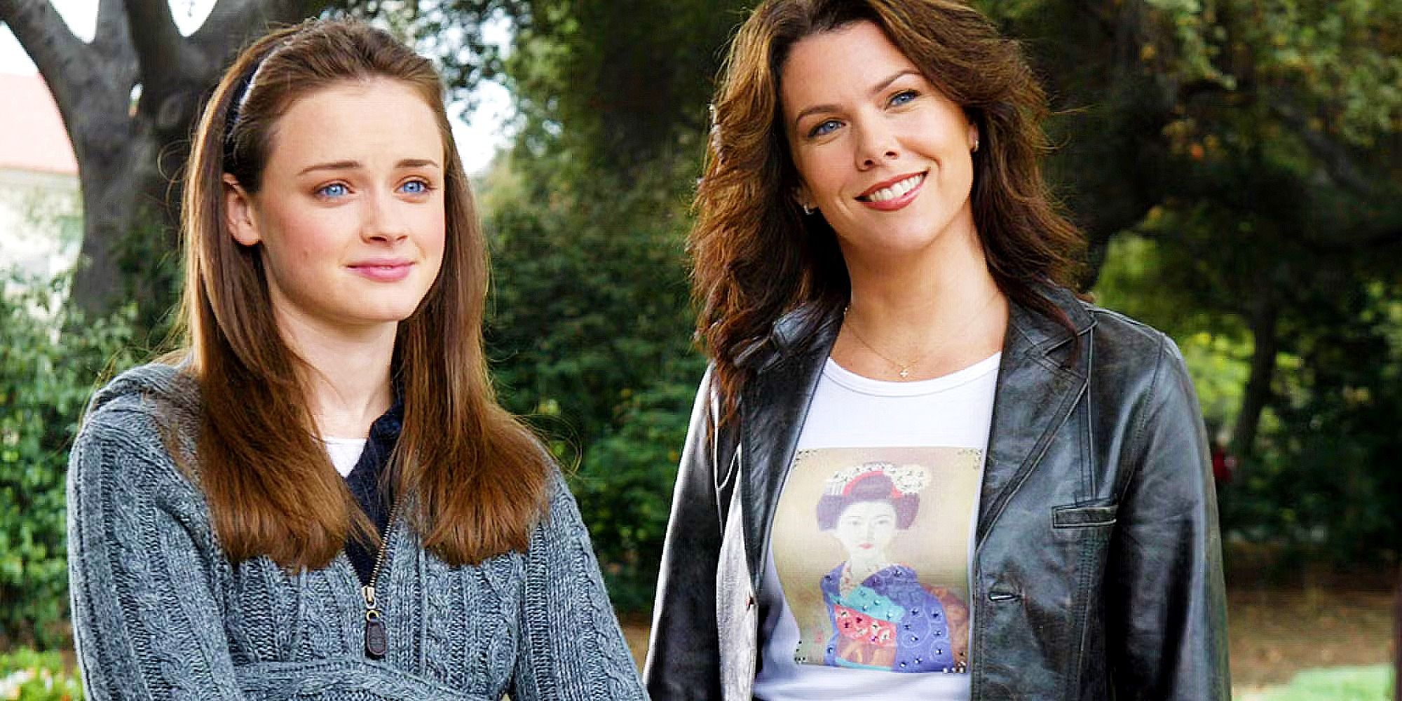 Rory and Lorelai smiling in Gilmore Girls standing next to each other