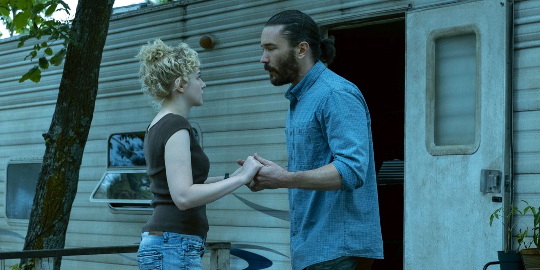 Ruth and Ben hold hands in Ozark