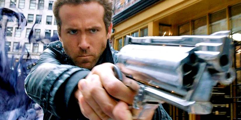 Ryan Reynolds pointing a gun in RIPD