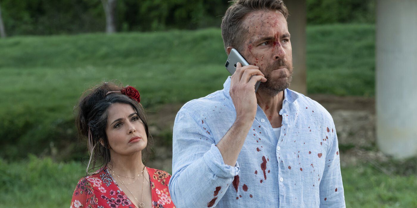 Salma Hayek as Sonia Kincaid and Ryan Reynolds as Michael Bryce in Hitman's Wife's Bodyguard