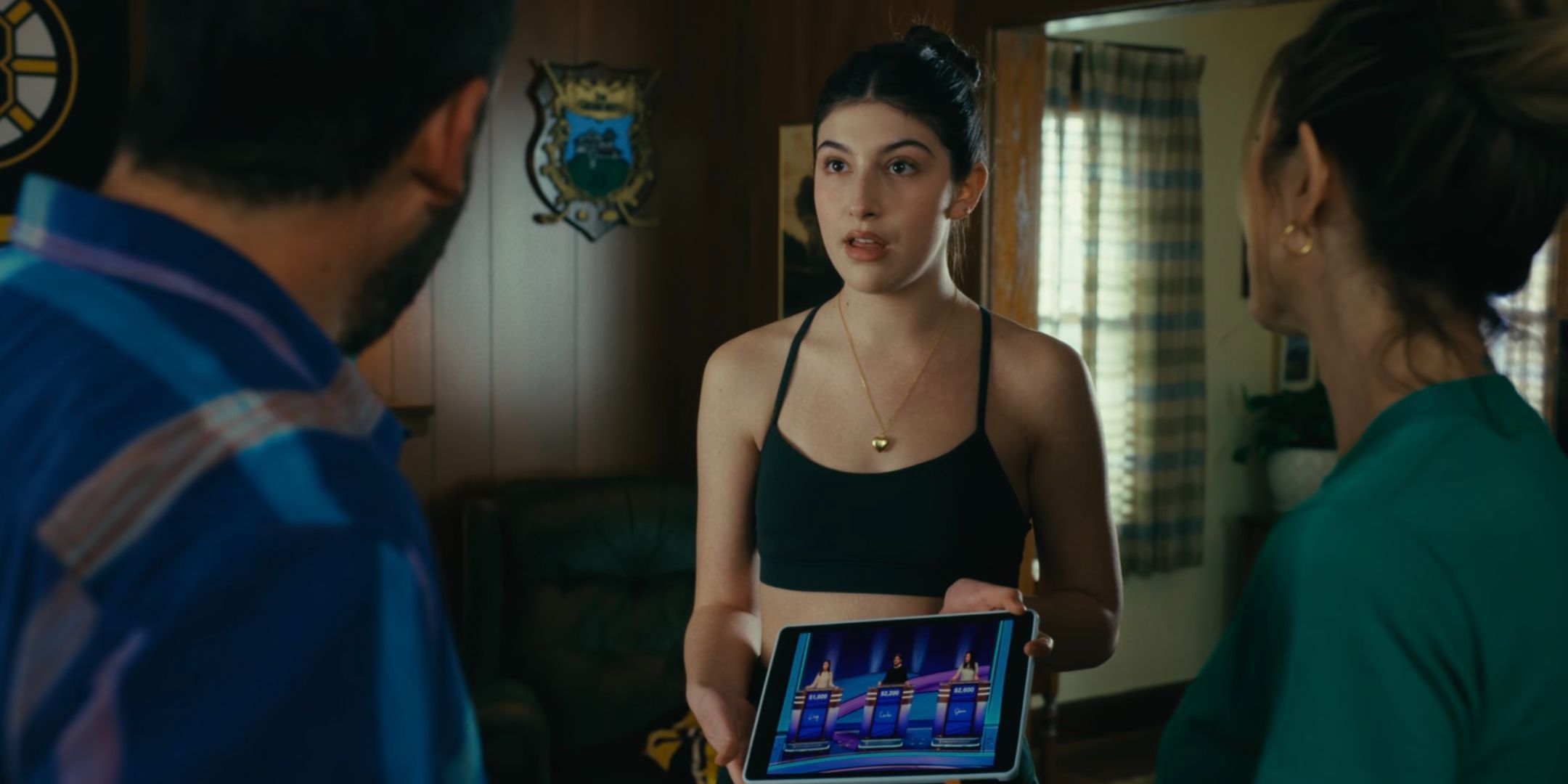 Sunny Sandler showing her dad a Jeopardy clip in Happy Gilmore 2