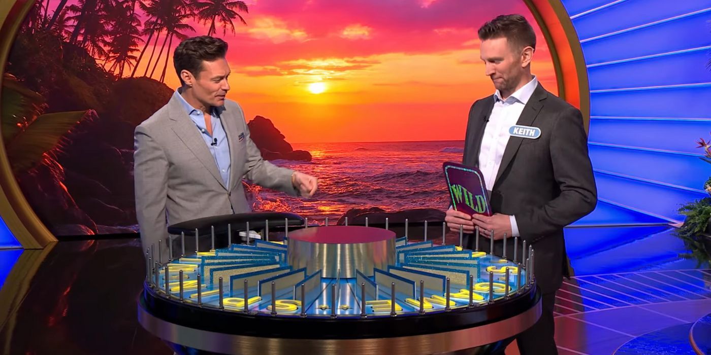 Wheel of Fortune's Ryan Seacrest and a player standing before a game 
