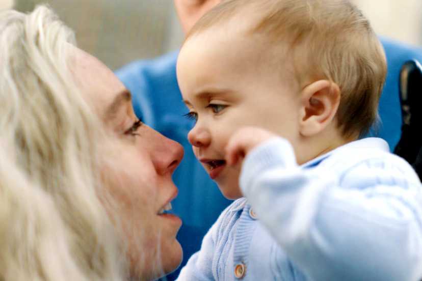 Sue Storm holds a baby Franklin Richards close to her face in The Fantastic Four: First Steps