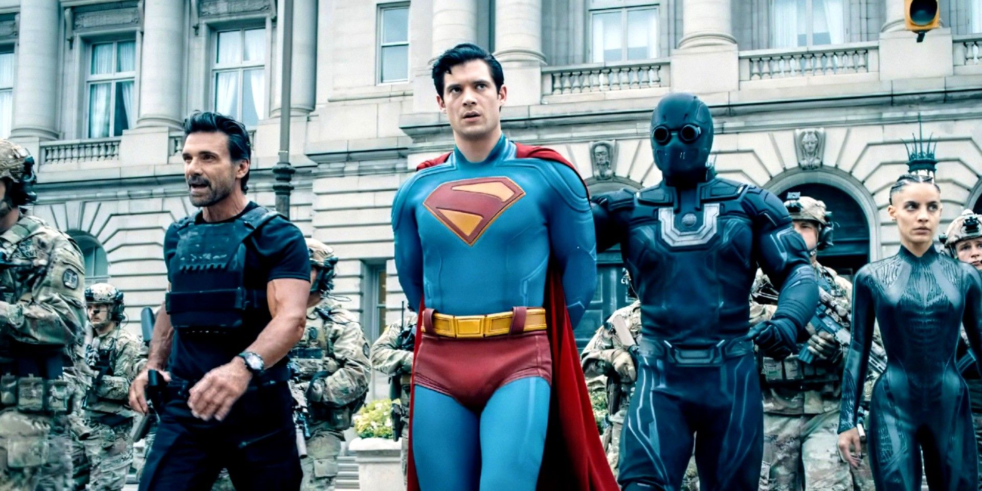 Superman is getting arrested by Ultraman in Superman