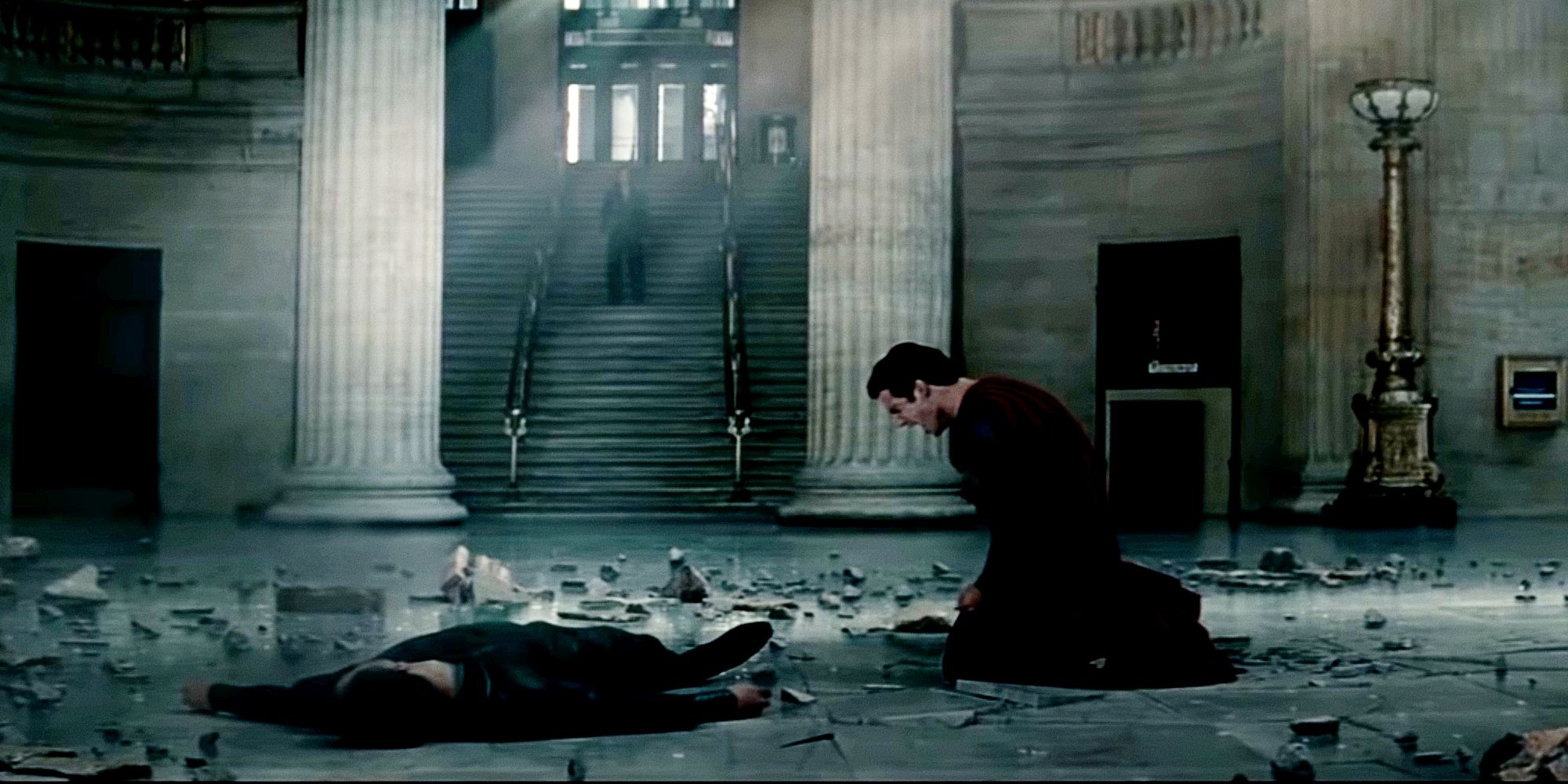 Superman kneels before Zod after snapping his neck in Man of Steel