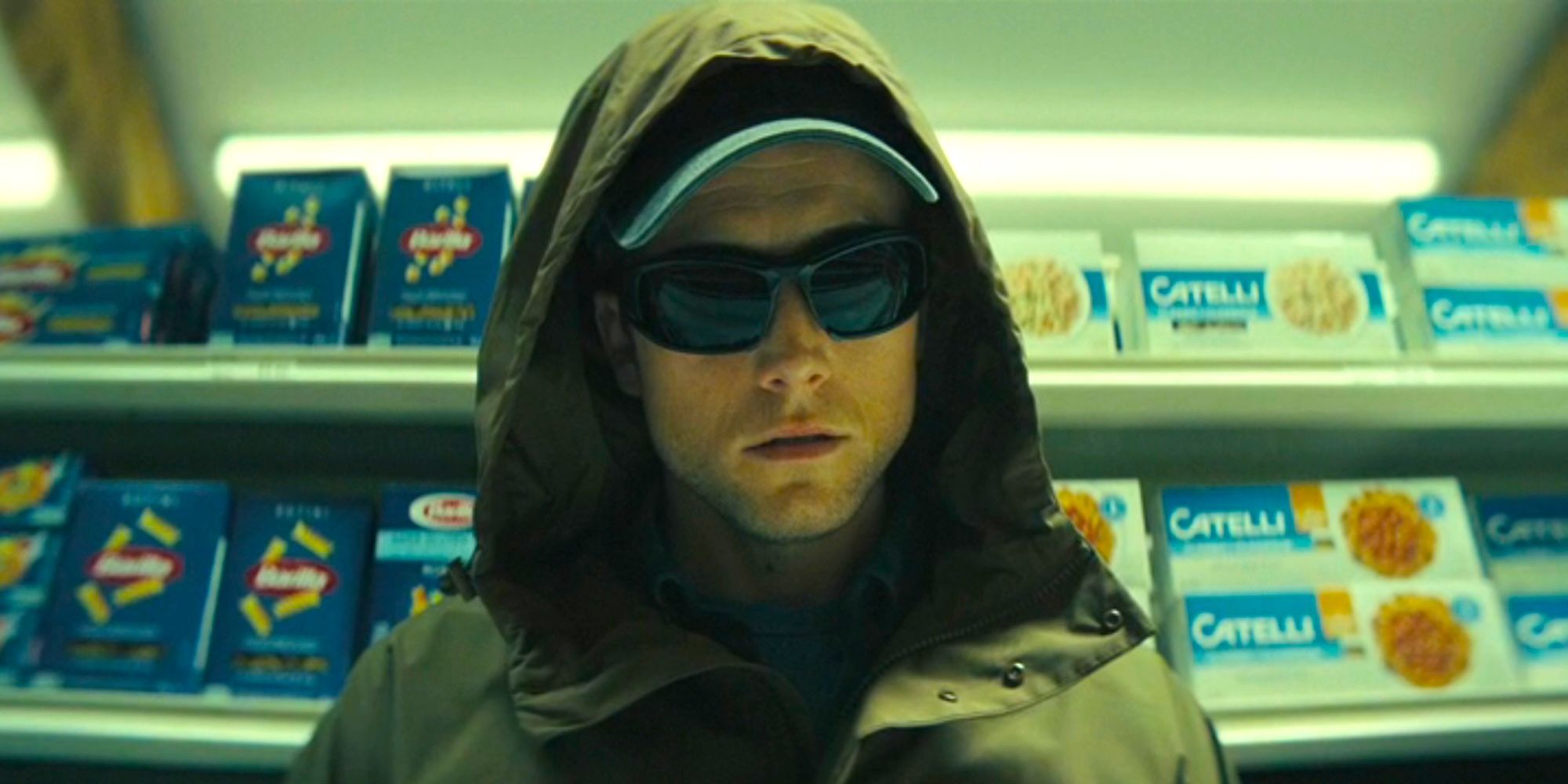 Taron Egerton as Dave dressed in his arsonist outfit in a store in Smoke episode 4