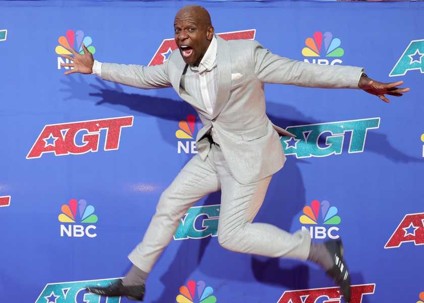 Terry Crews jumping in the air at the America's Got Talents season 20 red carpet event