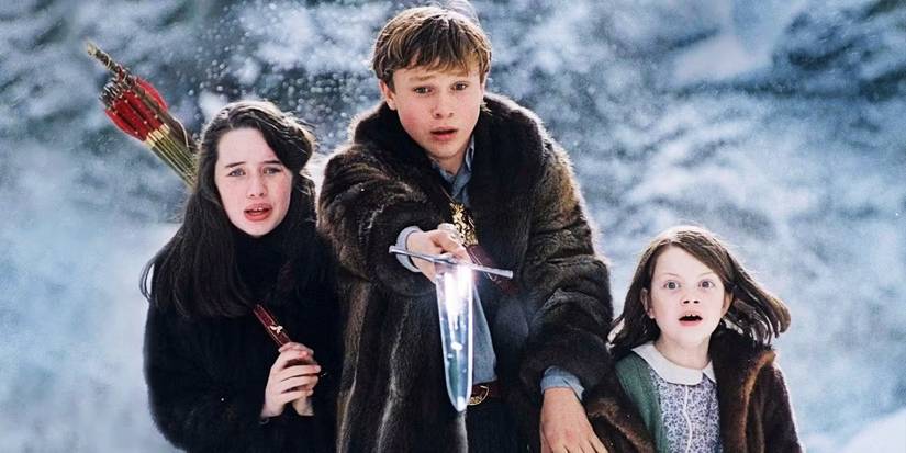 The Pevensie kids clustered together with a sword in The Chronicles of Narnia
