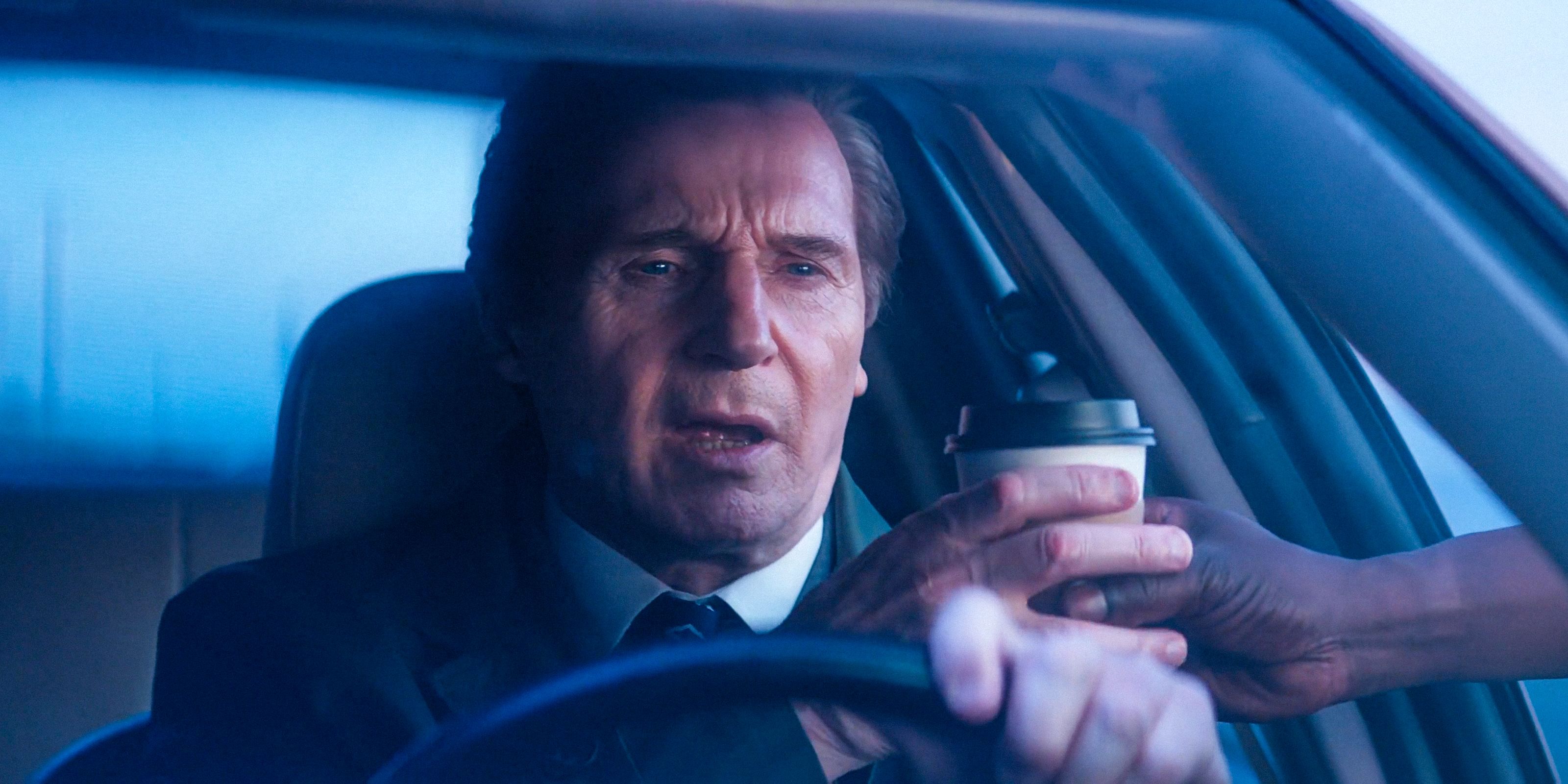 Frank Drebin Jr. (Liam Neeson) having his coffee in The Naked Gun (2025)