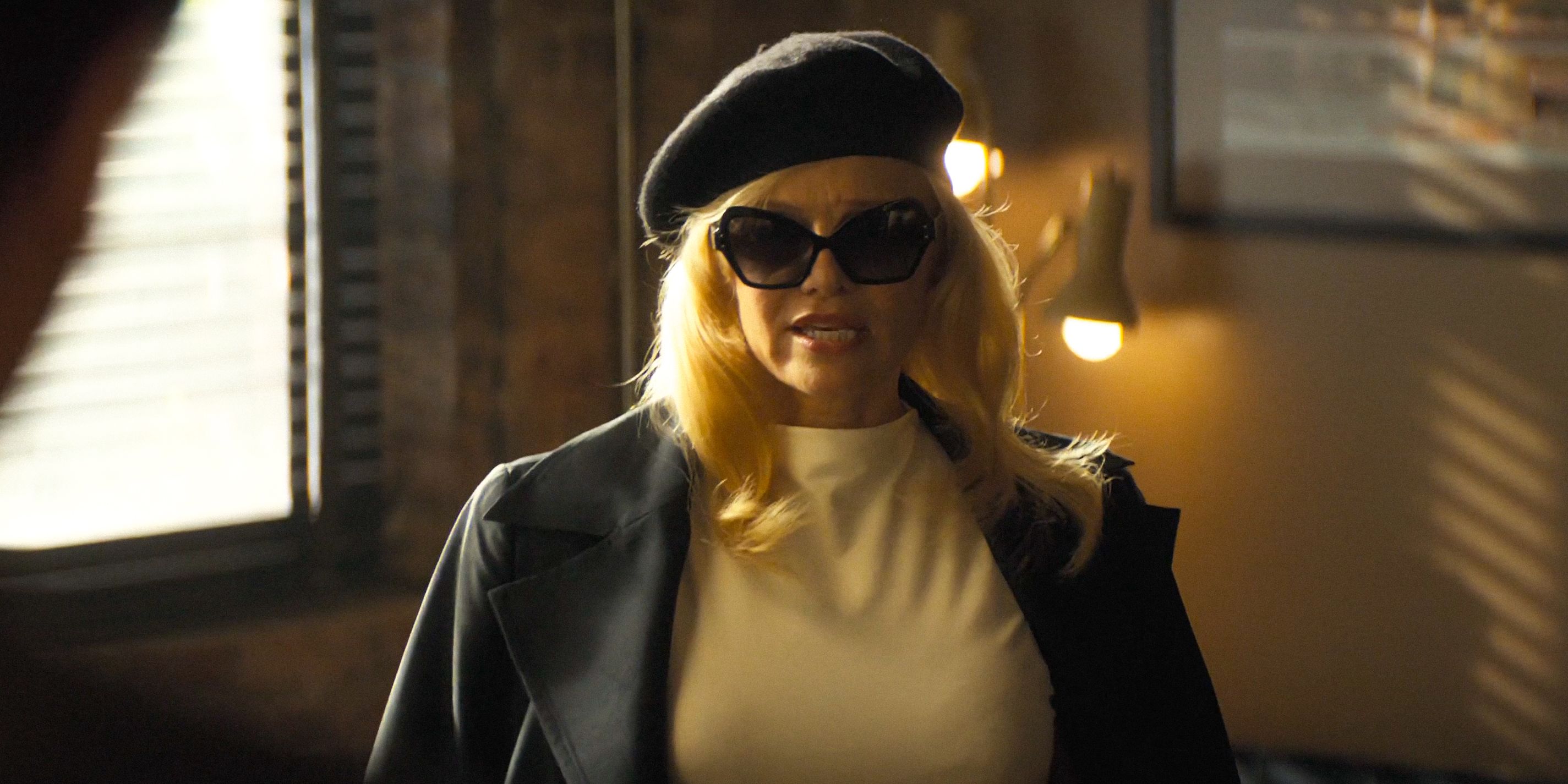Beth (Pamela Anderson) wearing sunglᴀsses and a beret in The Naked Gun (2025)
