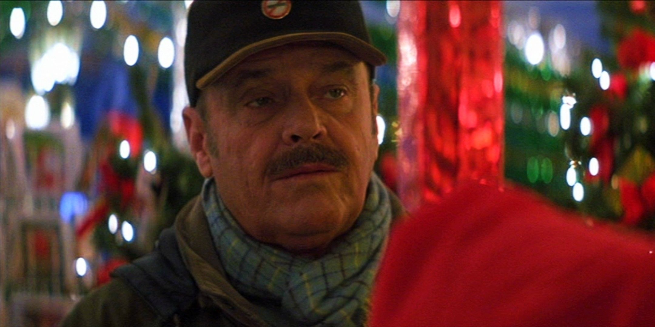 Jack Nicholson looks on in surprise while surrounded by Christmas lights in The Pledge
