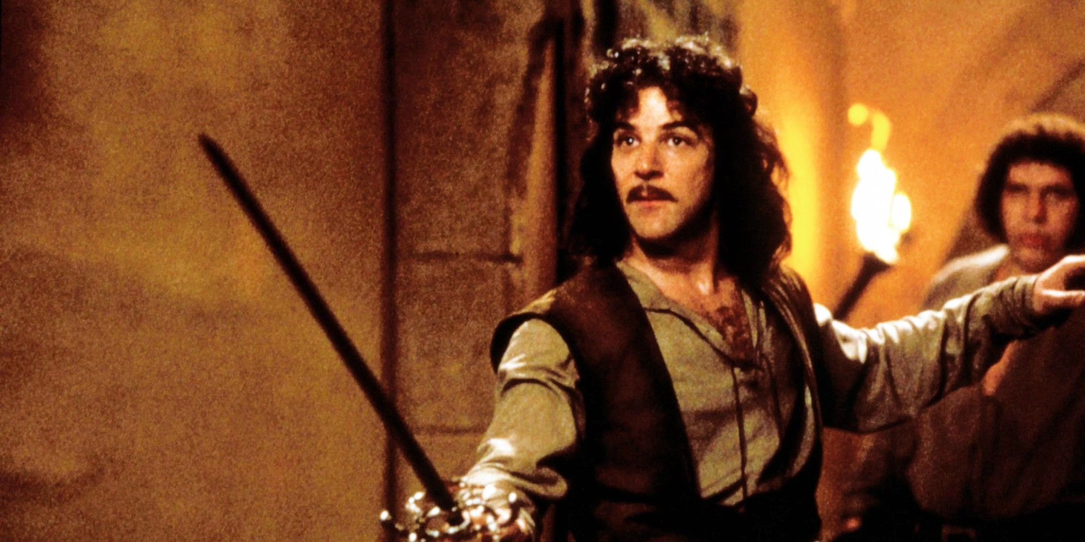 Inigo Montoya holds up his sword in the castle hallway in The Princess Bride