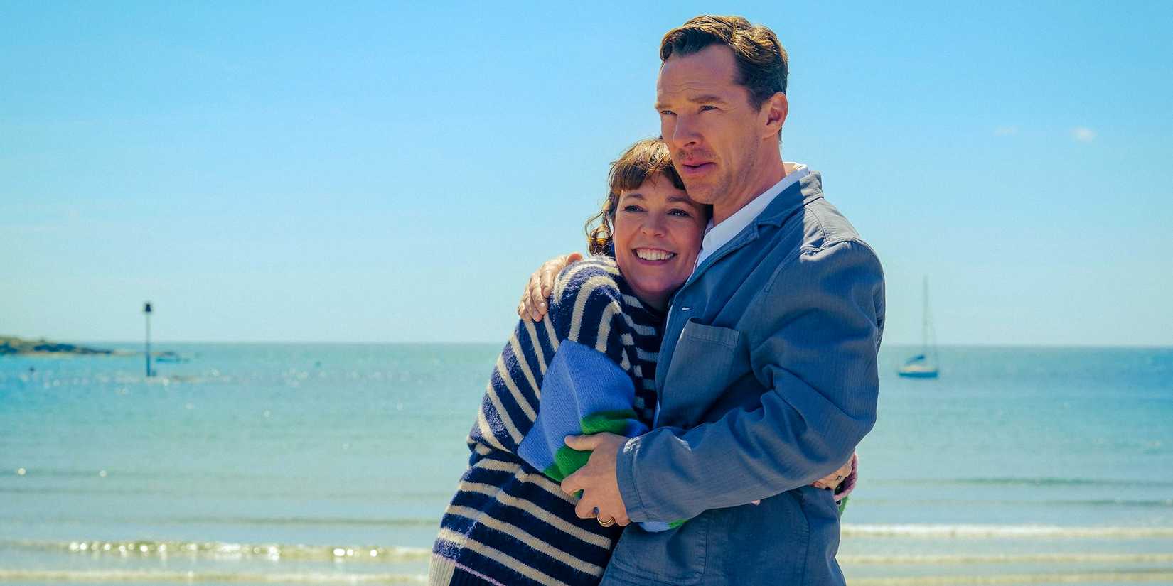 Olivia Colman and Benedict Cumberbatch embracing on the beach in The Roses