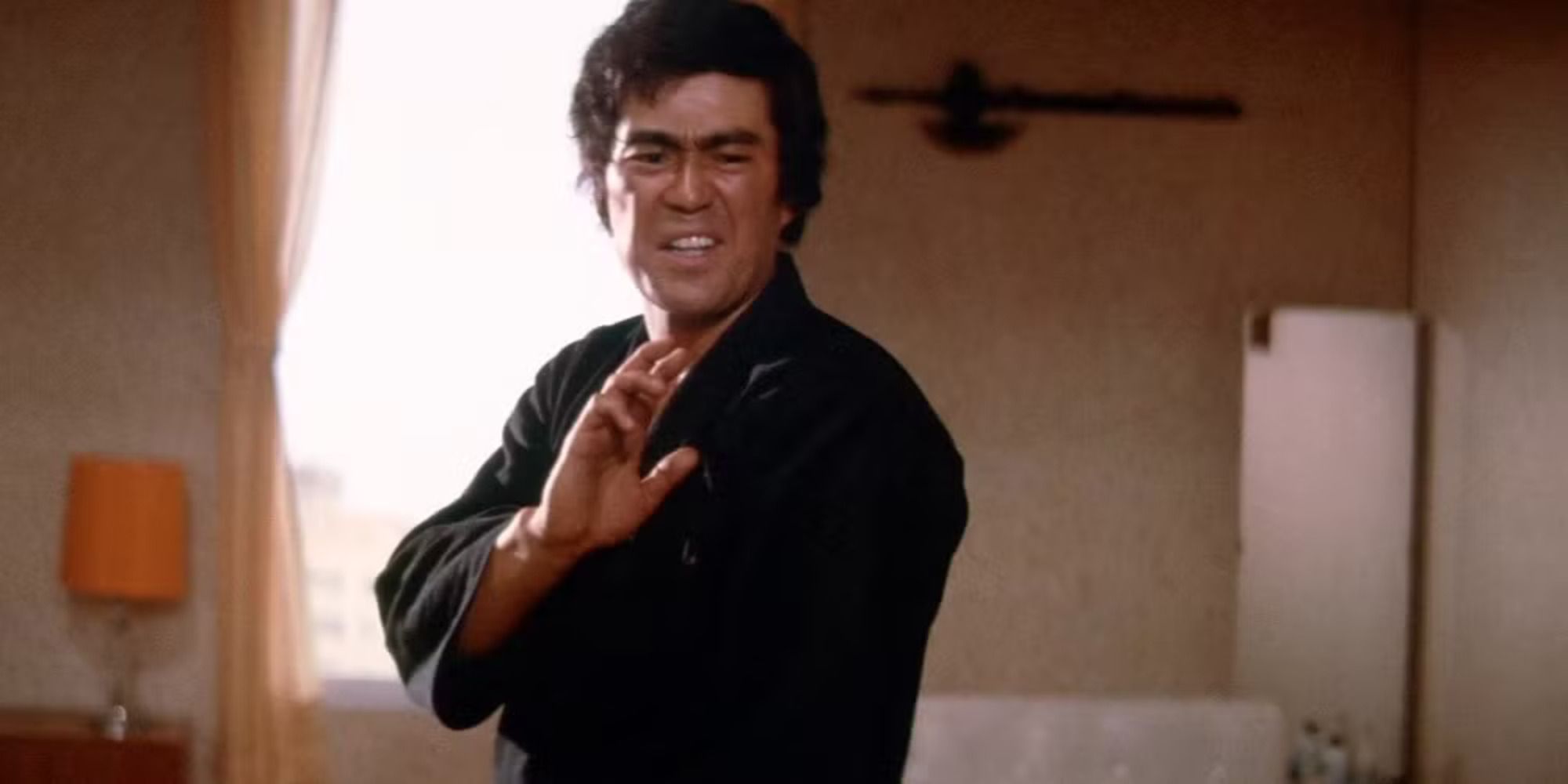 Chiba as Takuma (Terry) Tsurugi displaying his martial arts skills in The Street Fighter.