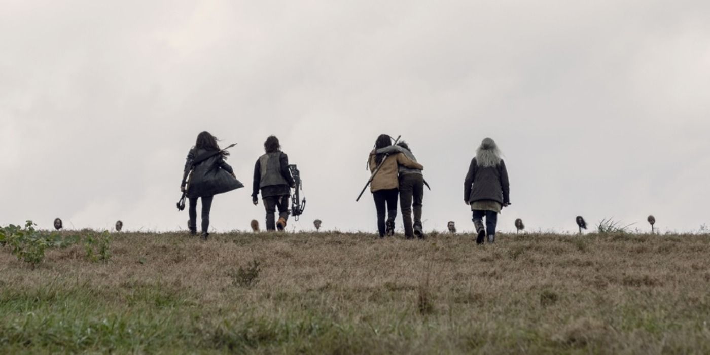 The survivors approaching heads on pikes in the Walking Dead Calm Before