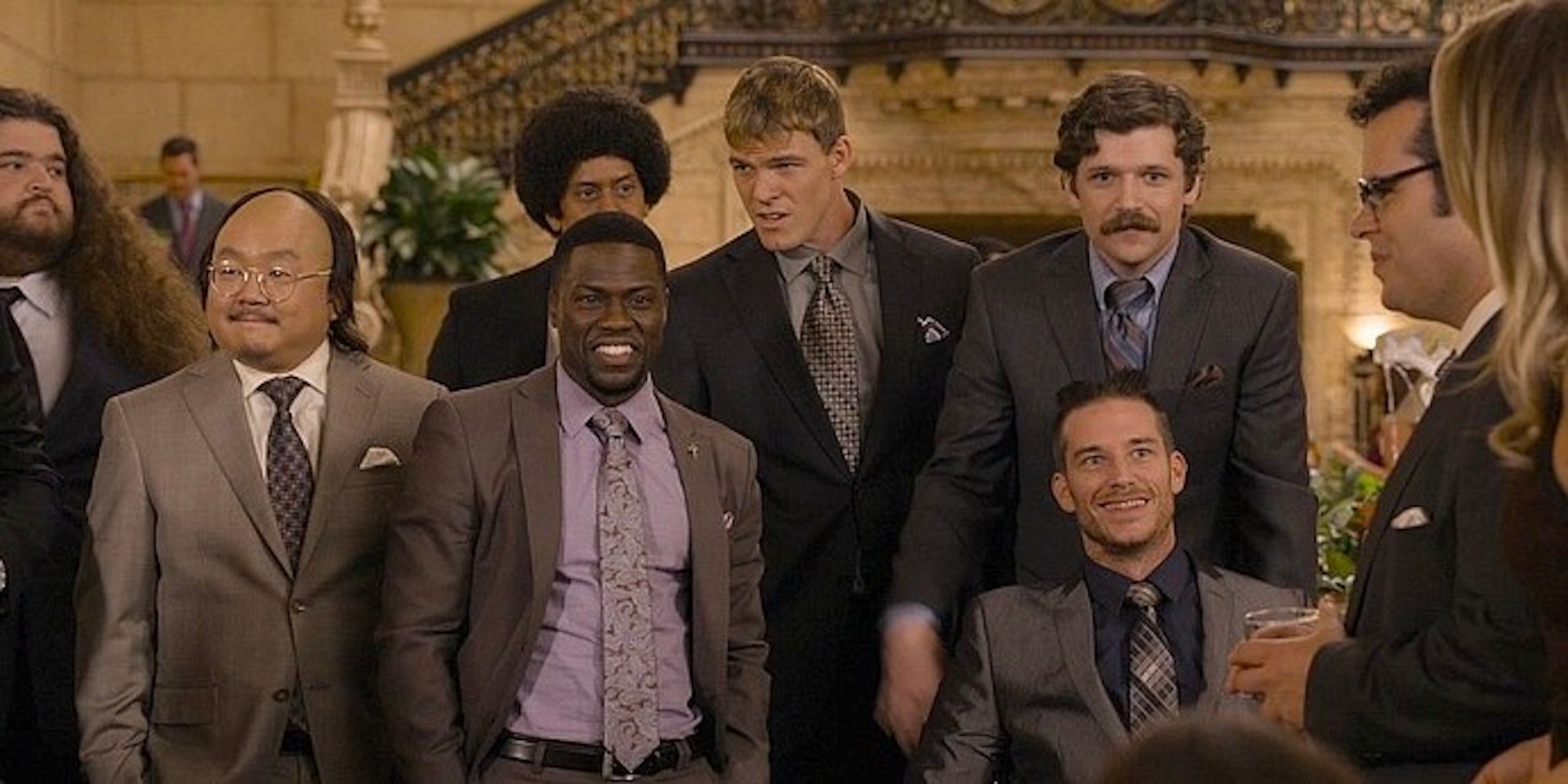Doug's groomsmen are dressed in suits. 
