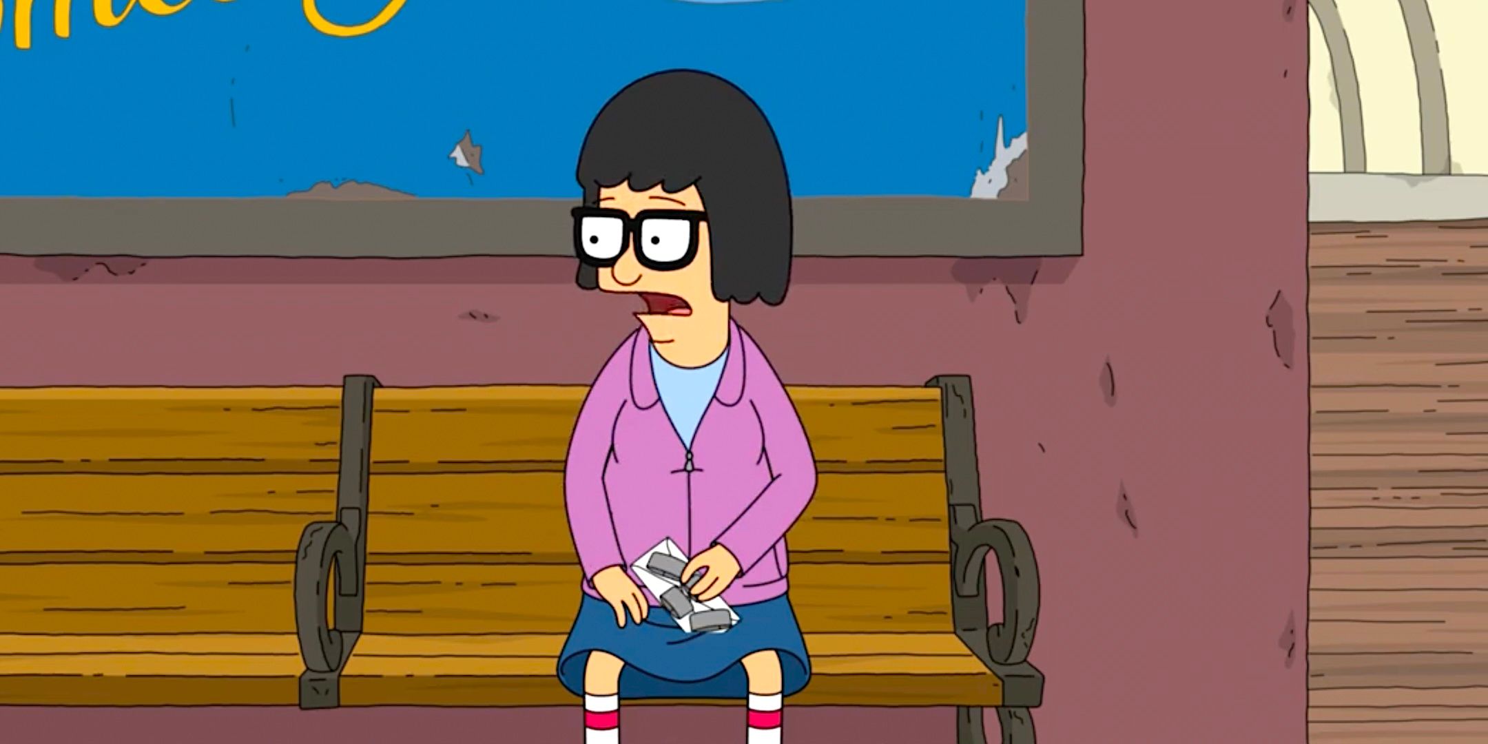 Tina sits on a bench looking panicked with a package from Bob's Burgers season 15 episode 17