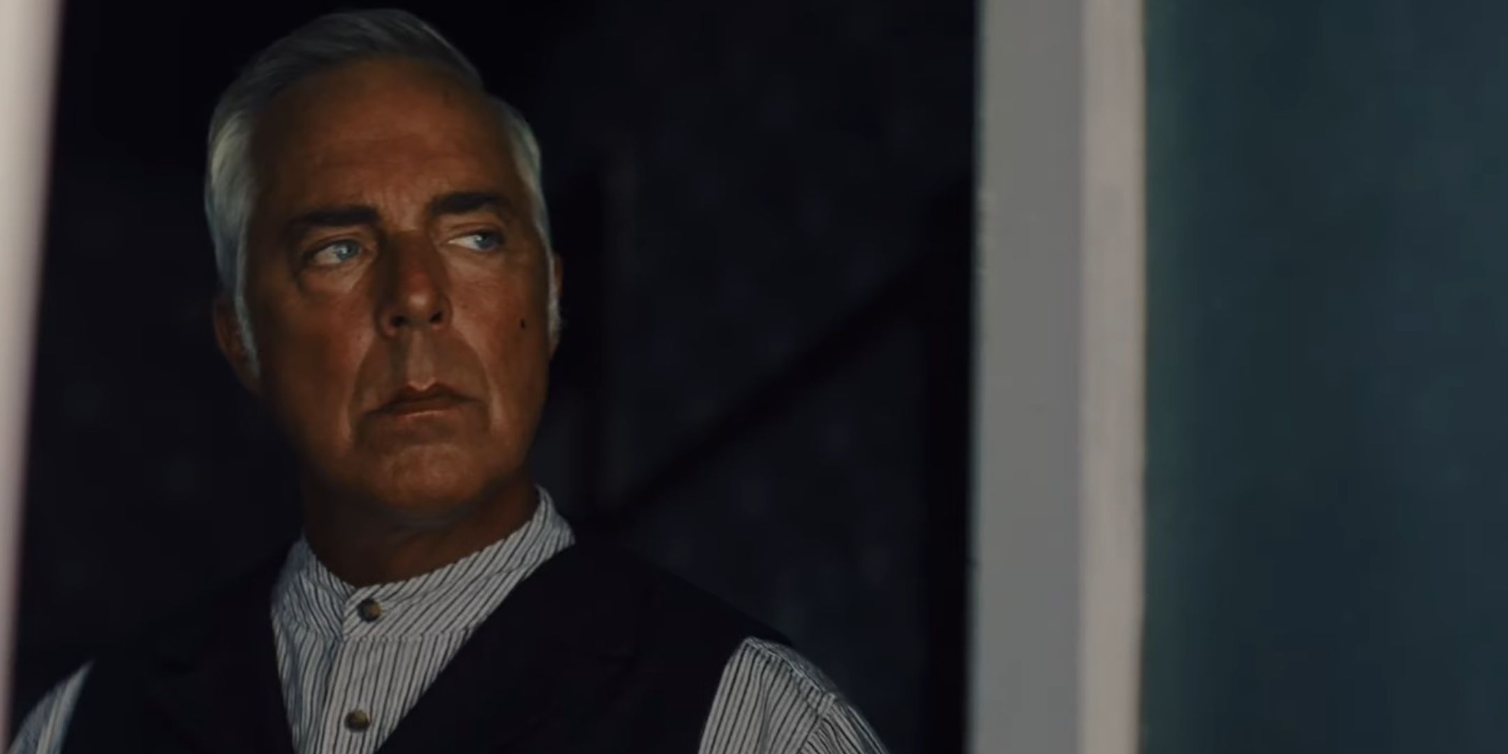 тιтus Welliver's Abraham Van Helsing looking cautiously through his front door in Abraham's Boys: A Dracula Story
