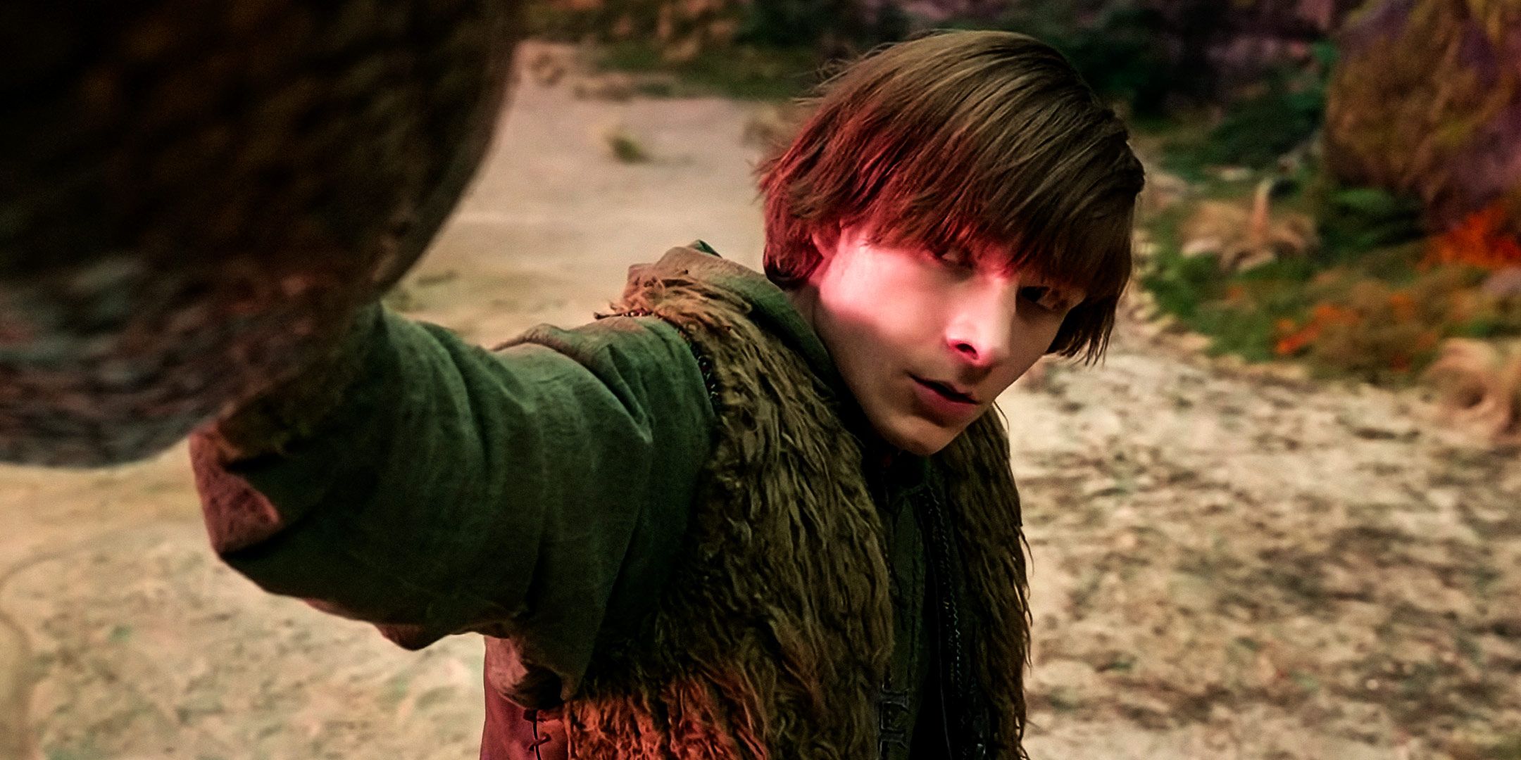 Mason Thames as Hiccup looking nervously at Toothless while touching his snout in How to Train Your Dragon 2025