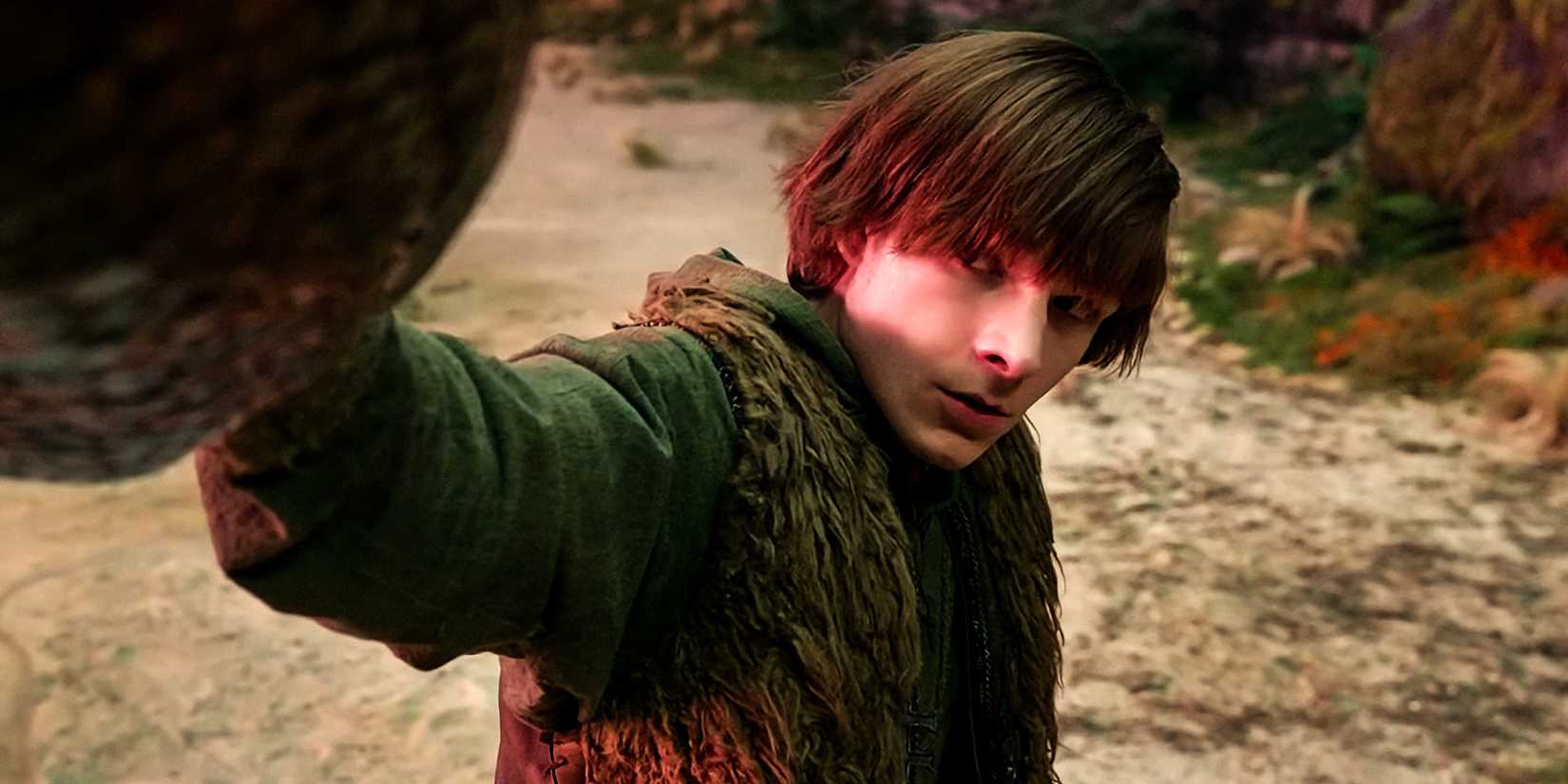 Mason Thames as Hiccup looking nervously at Toothless while touching his snout in How to Train Your Dragon 2025