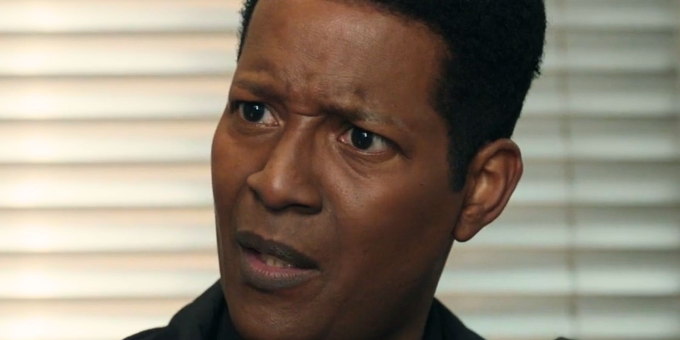 Corey Reynolds looking confused as Mike Thompson in Resident Alien