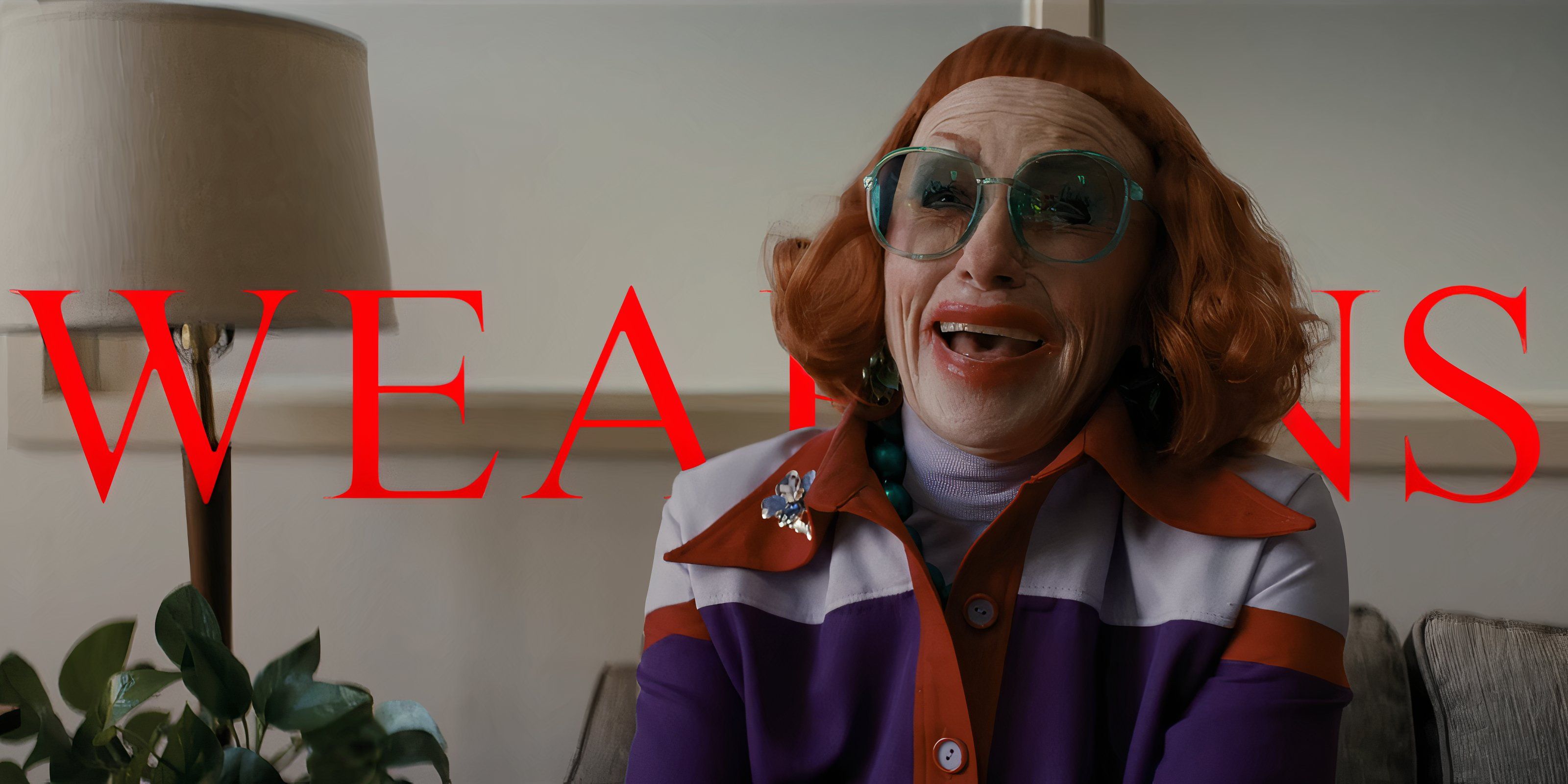 A person with red hair wearing big glᴀsses in Weapons