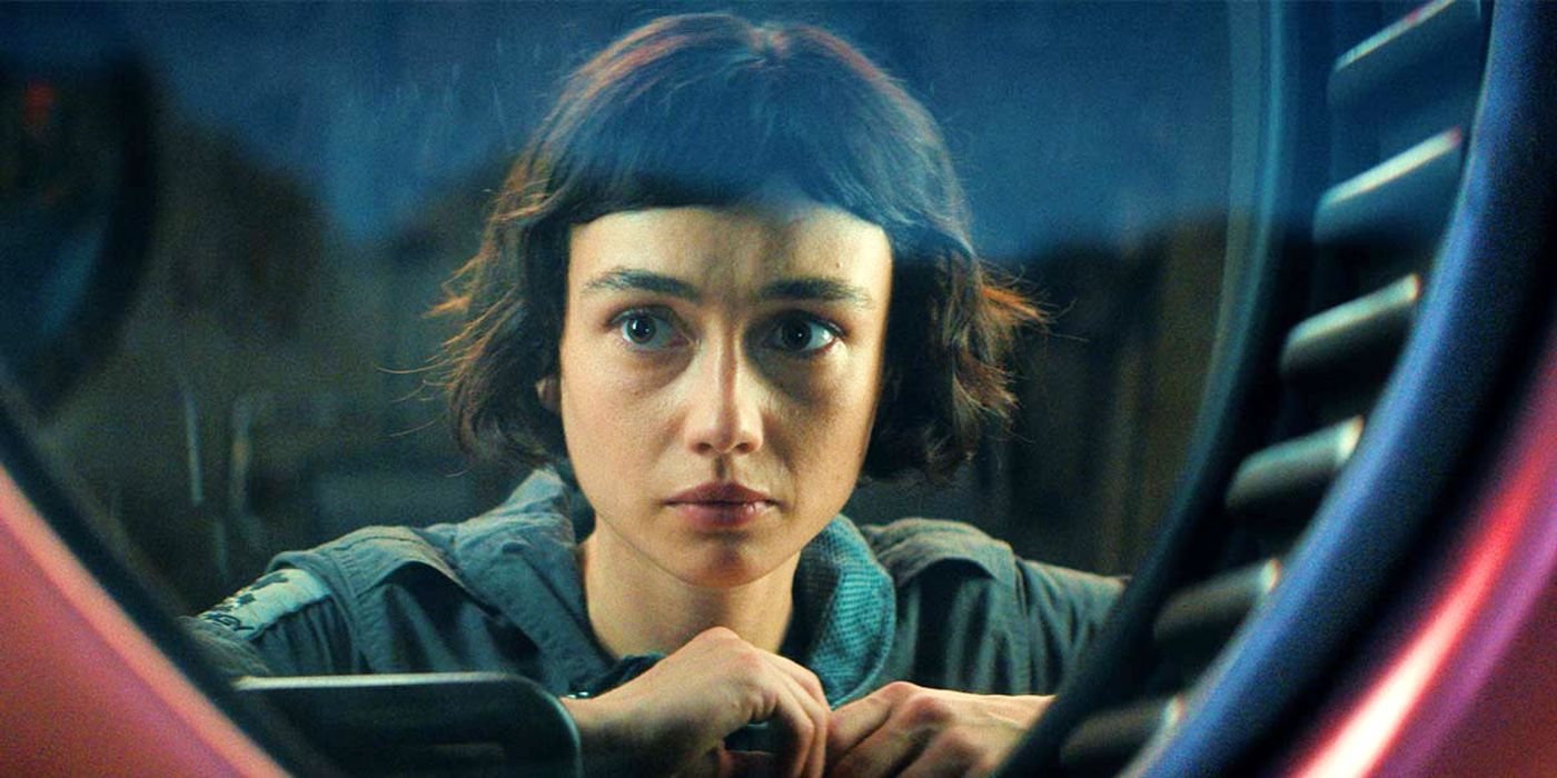 Sydney Chandler as Wendy looking out a window with slight concern in Alien: Earth