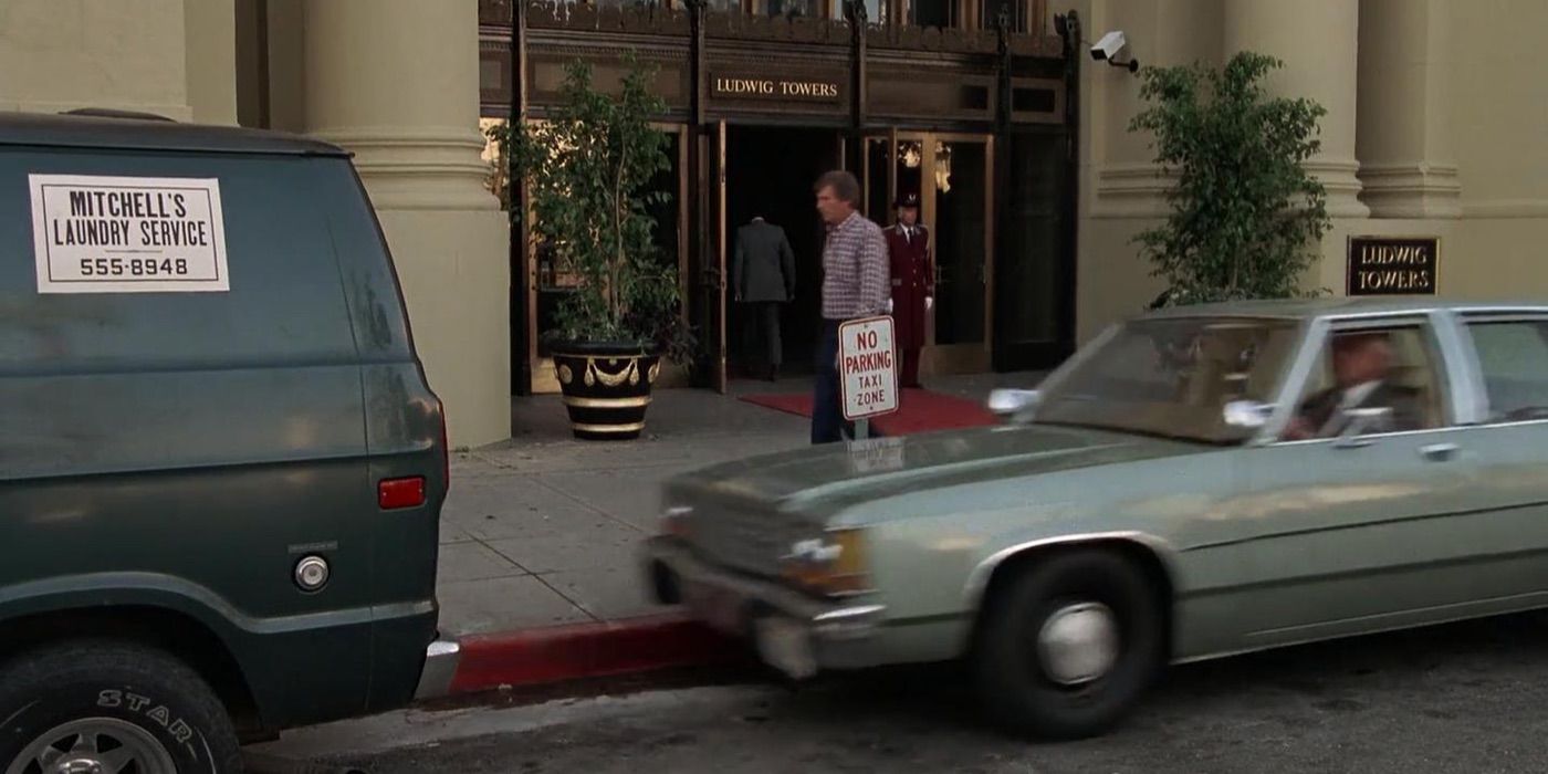 A car crashing into the back of a van in The Naked Gun