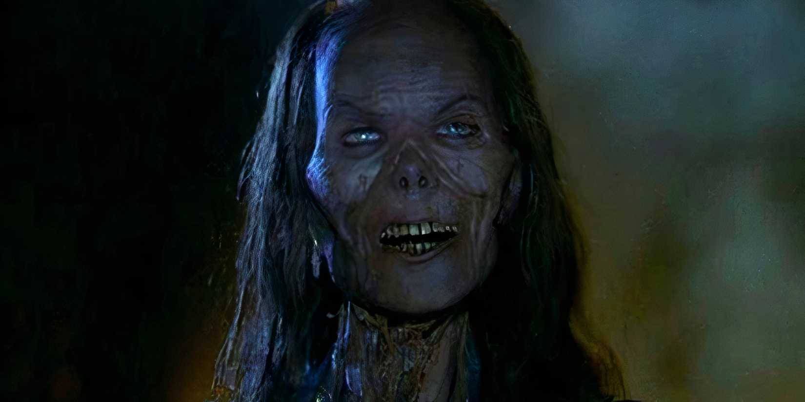 A smiling corpse woman in the Rose Red TV show