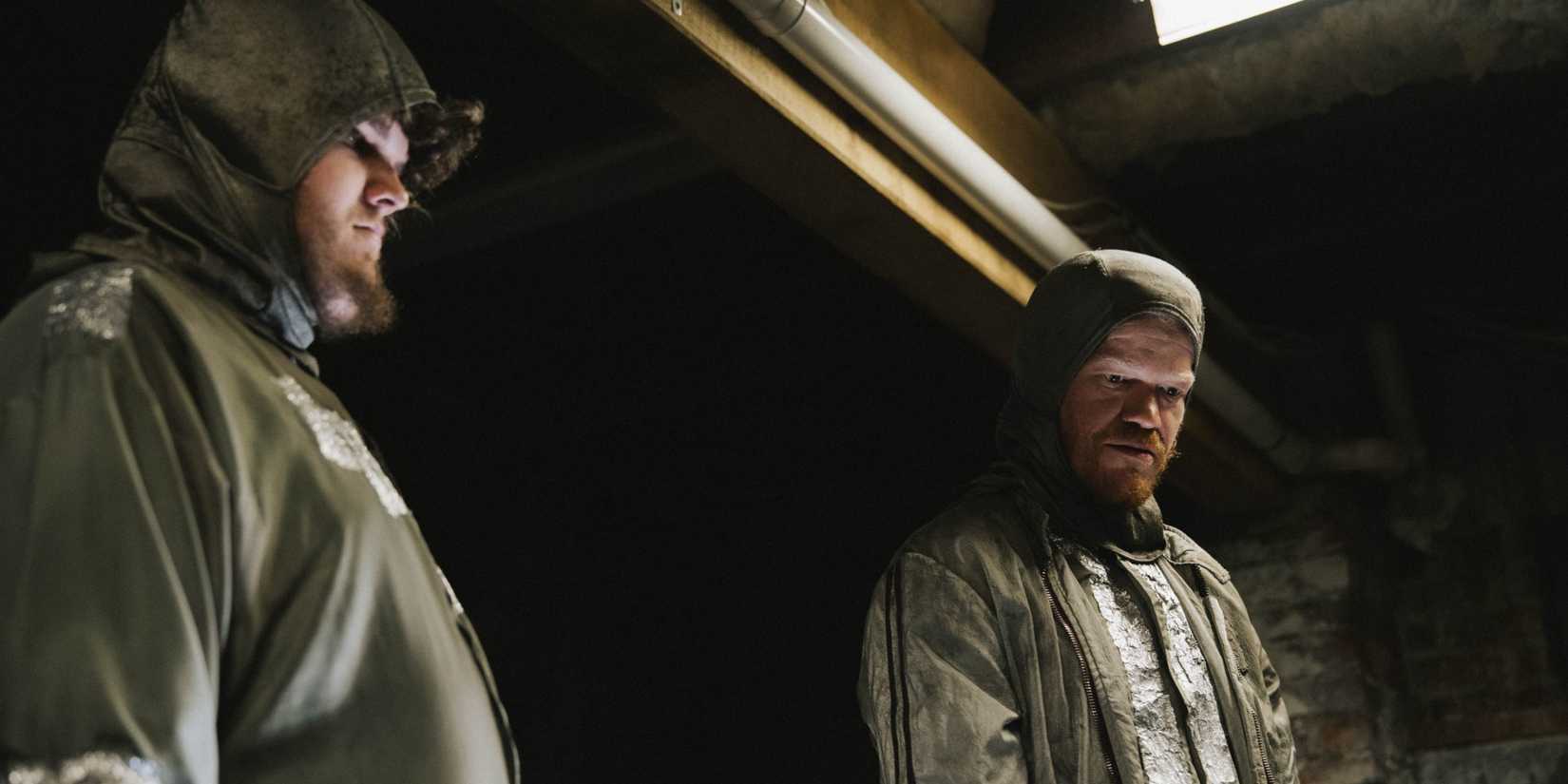 Aidan Delbis and Jesse Plemons in beekeeper suits in Bugonia