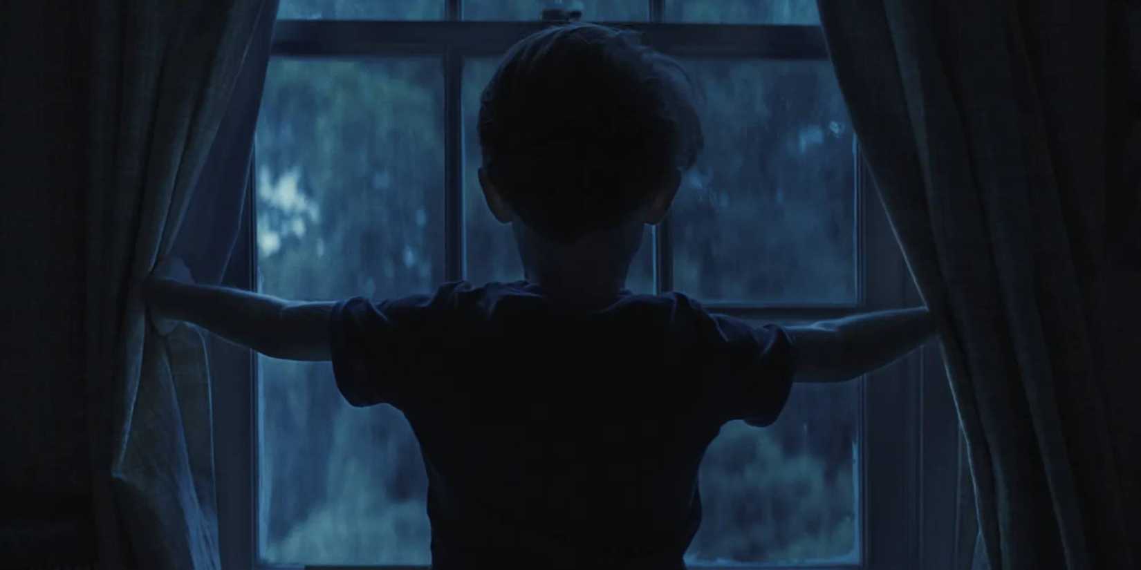 Alex looking out the window in Weapons