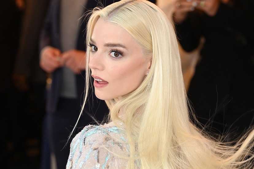 Anya Taylor-Joy looking over her shoulder on the red carpet