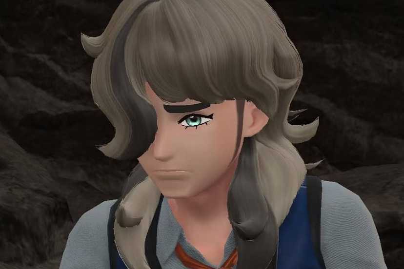 Arven looking very sad in a cave in Pokemon Scarlet.