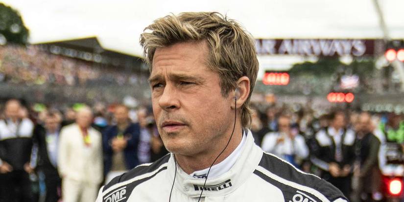 Brad Pitt wearing headphones as Sonny Hayes in F1 The Movie