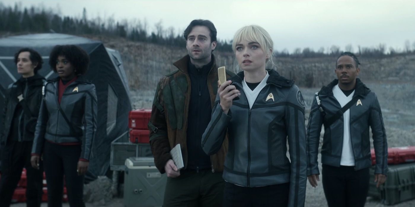 Nurse Chapel holds a communicator in front of a landing party on Star Trek Strange New Worlds