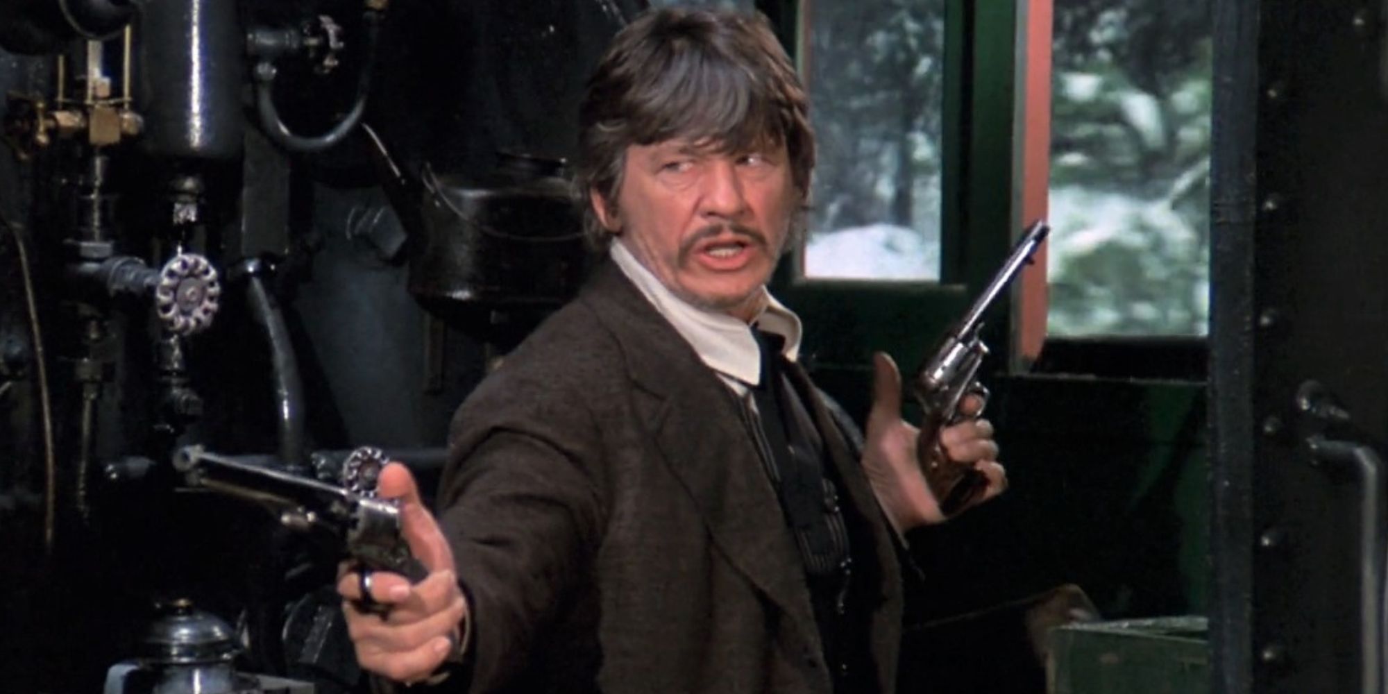 Charles Bronson as Deacon with his guns out in Breakheart Pass