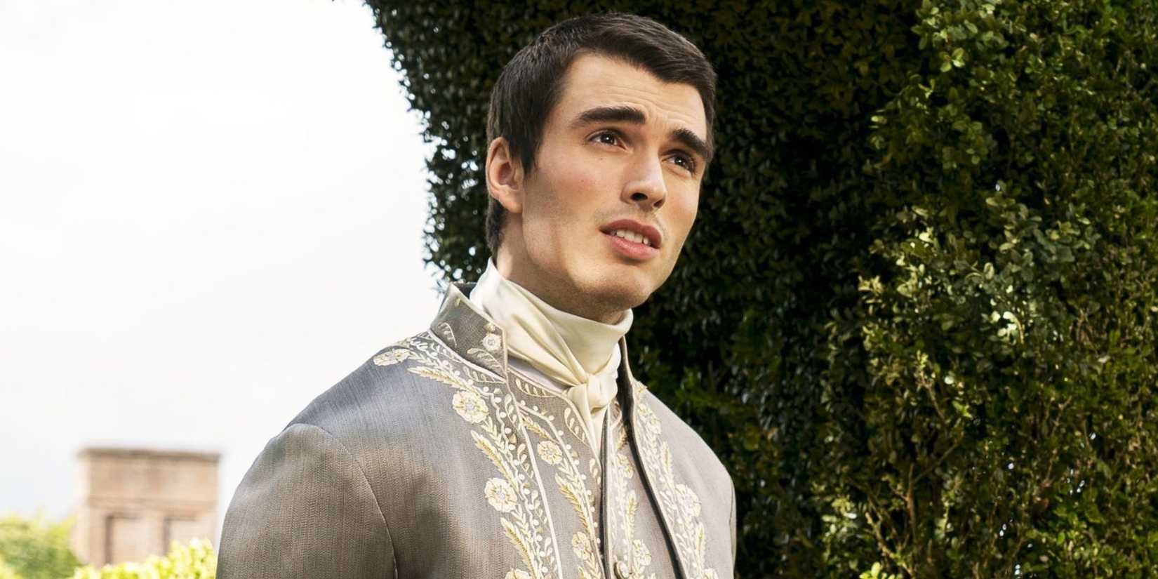 Corey Mylchreest as George poses near bushes in Queen Charlotte
