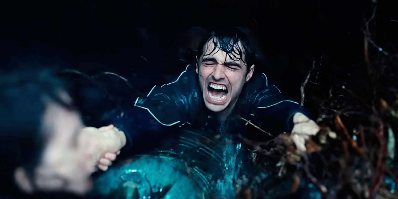 Dave Franco screams while submerged in water in a scene from Together