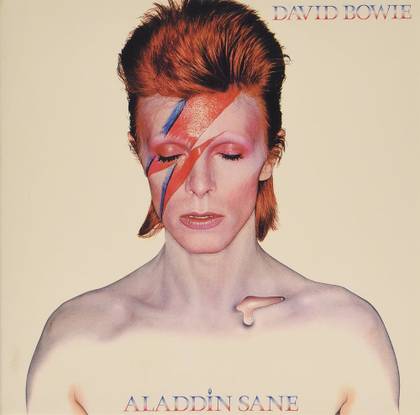 The album art for David Bowie's Aladdin Sane. It shows Bowie with a red and blue lightning bolt painted on his face.