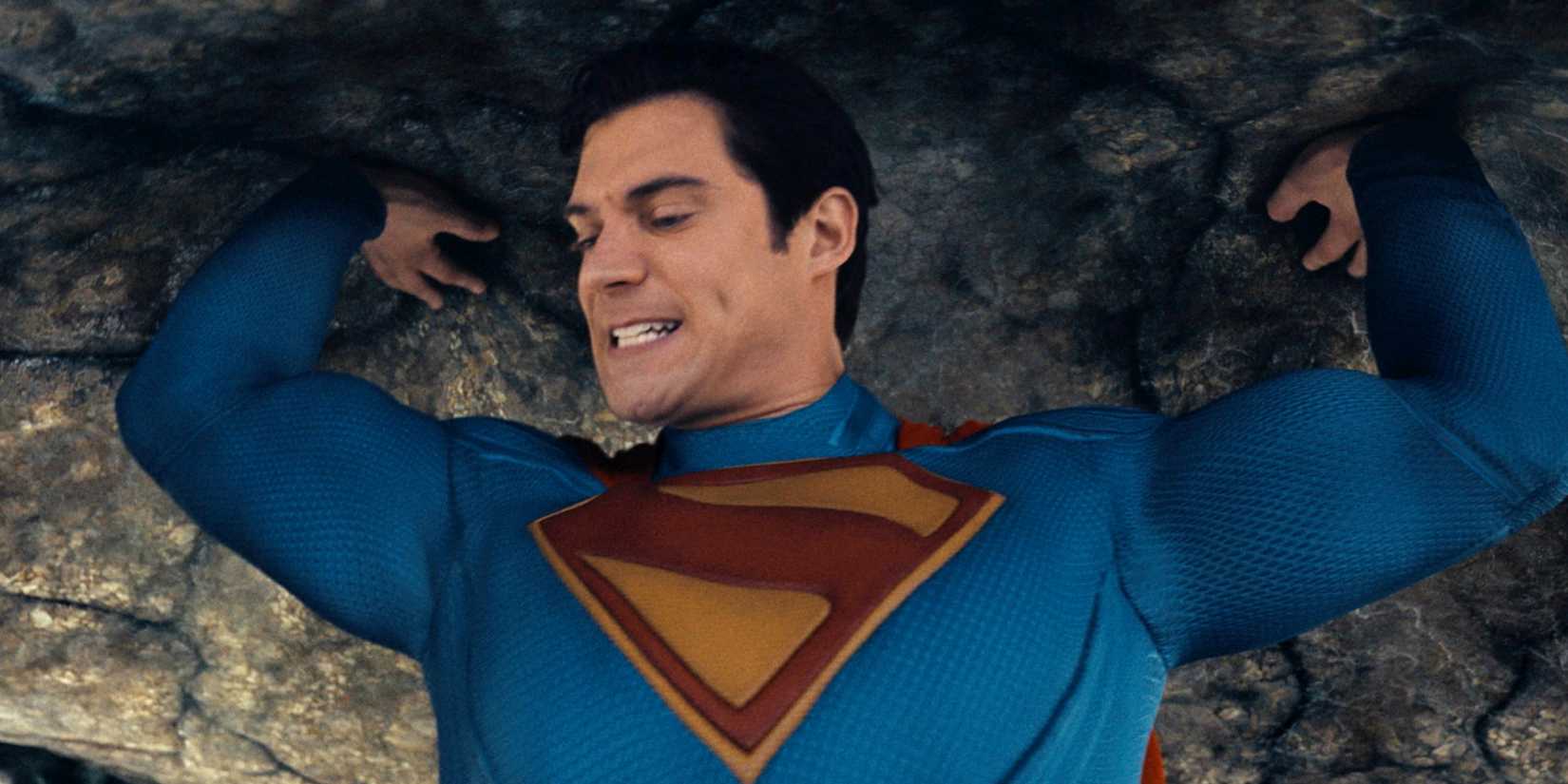 David Corenswet as Superman holding the kaiju's foot in Superman 2025