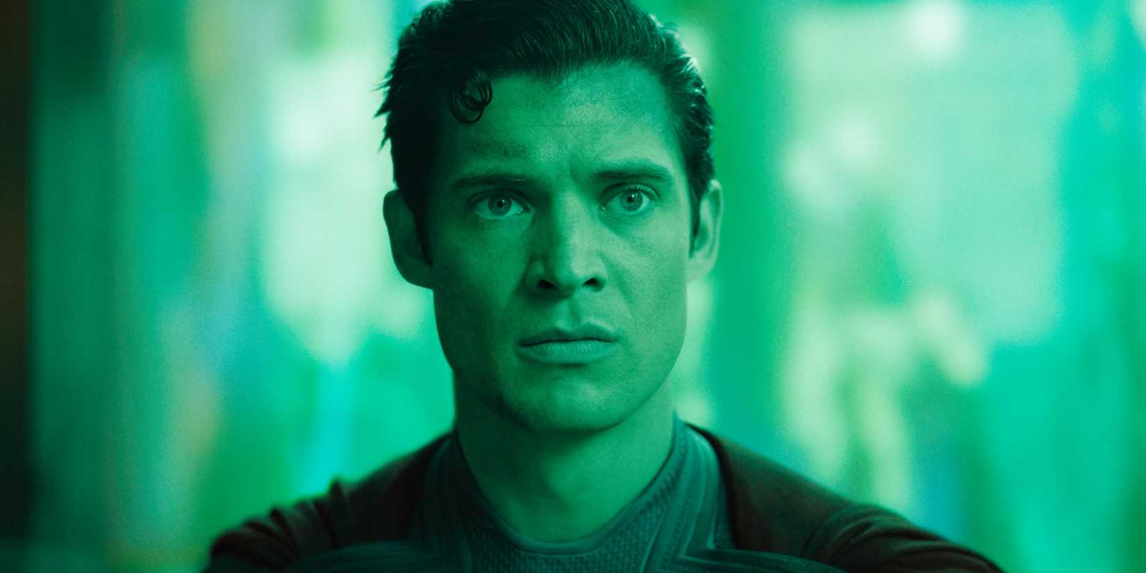 David Corenswet's Superman looking shocked with Green Lantern's green hue over him in DC's Superman movie