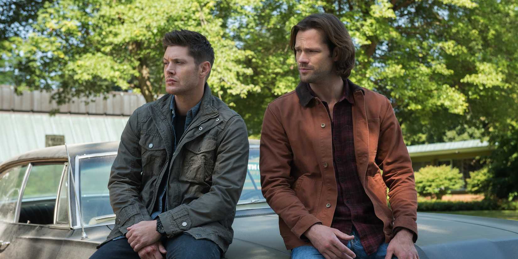 Dean and Sam Winchester in Supernatural sitting on top of Baby