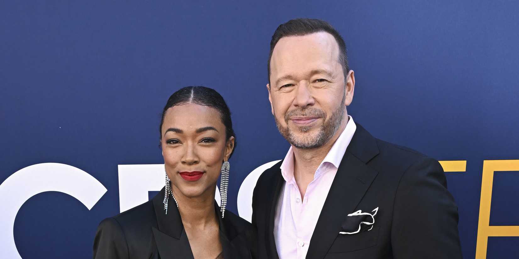 Donnie Wahlberg and Sonequa Martin-Green standing together on the red carpet