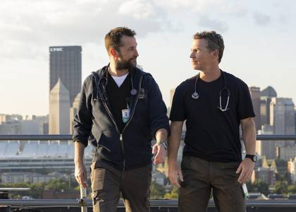 Dr Robby and Dr Abbott walk together on the rooftop of the ER in The Pitt season 1
