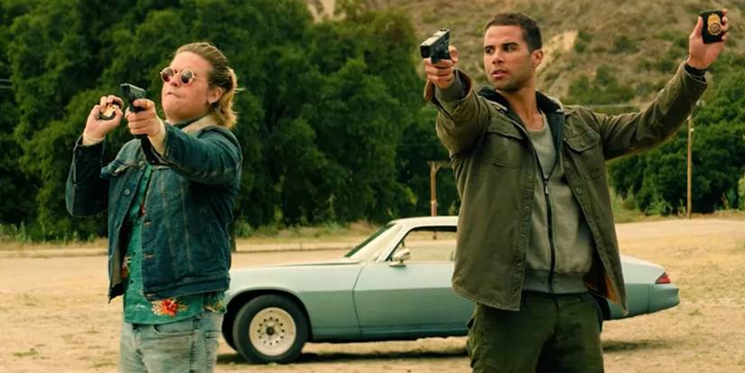Dylan Sprouse and Mason Gooding in Under Fire