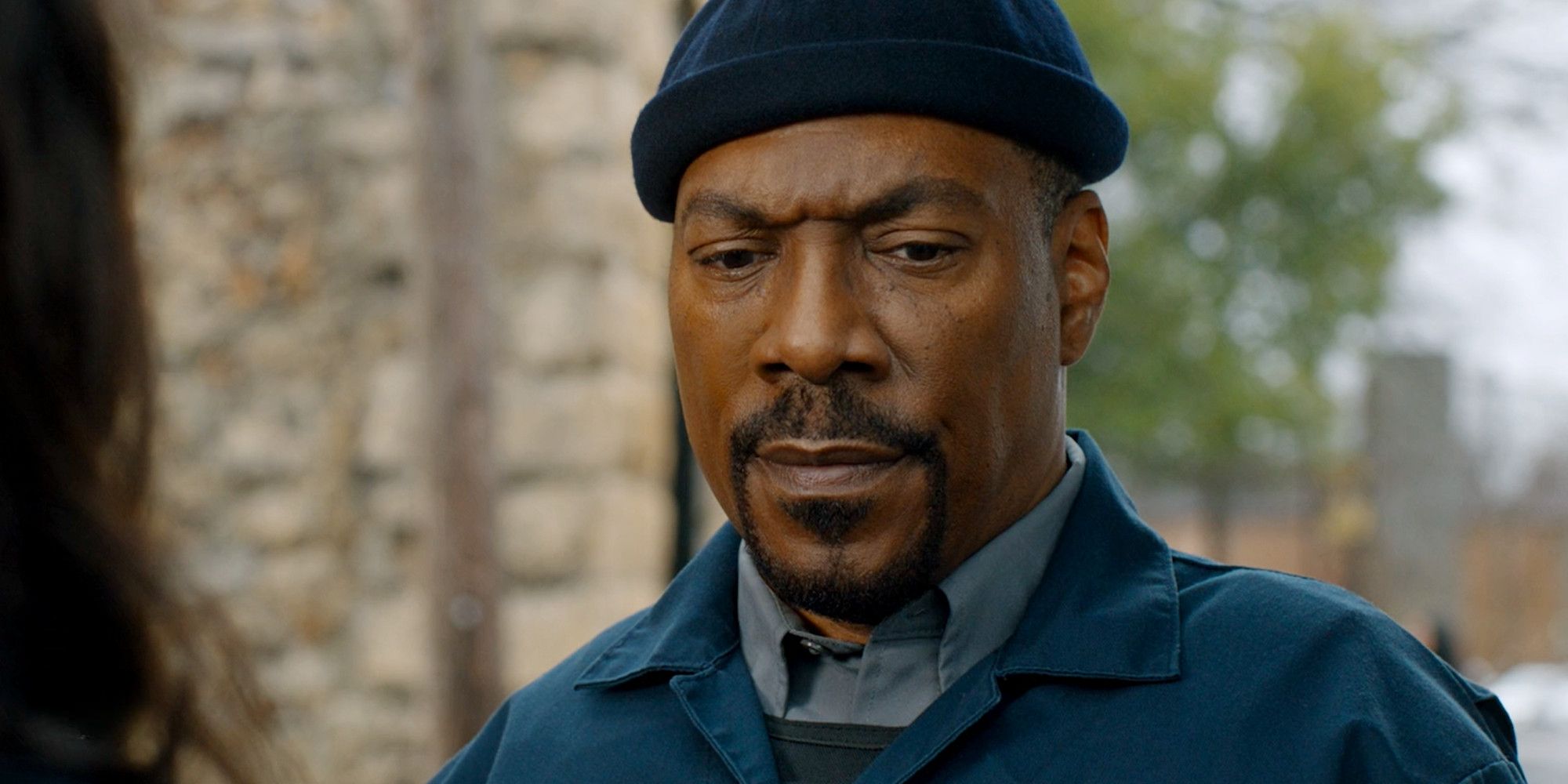 Eddie Murphy casts his gaze downward in a scene from The Pickup