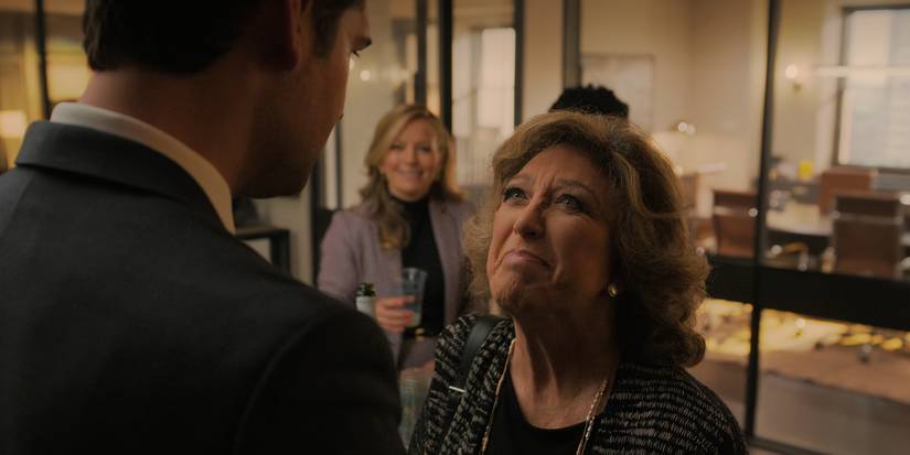 Elena looks up at Mickey in The Lincoln Lawyer season 2