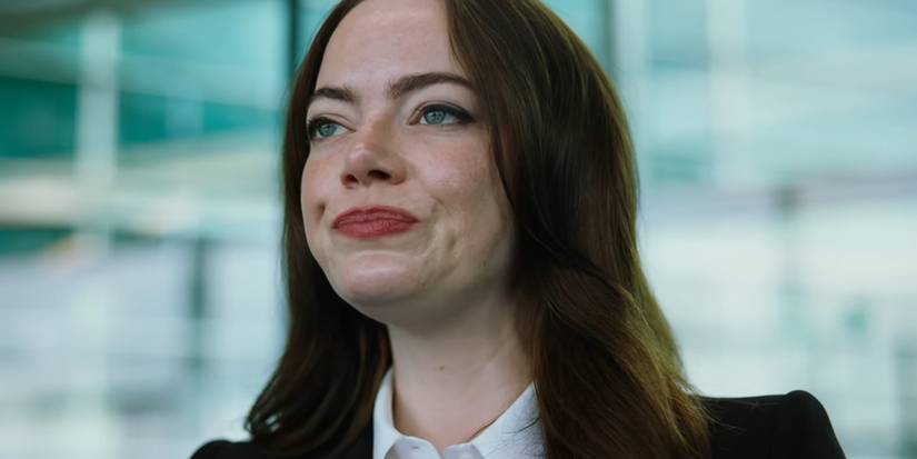 Emma Stone pursing her lips in Bugonia