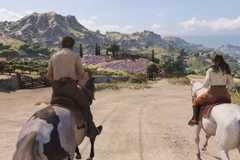 Enzo rides on horseback through the Sicilian countryside alongside Isabela
